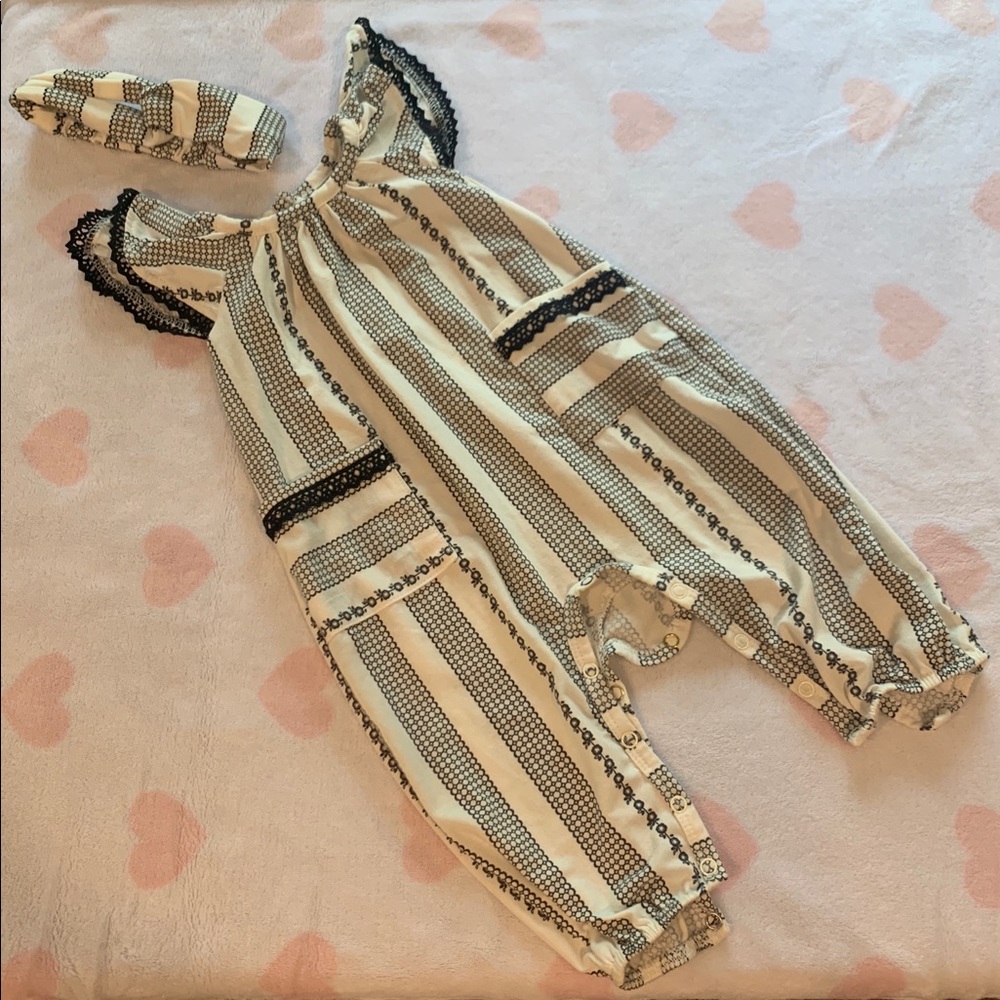 Black and white jumpsuit with matching headband.